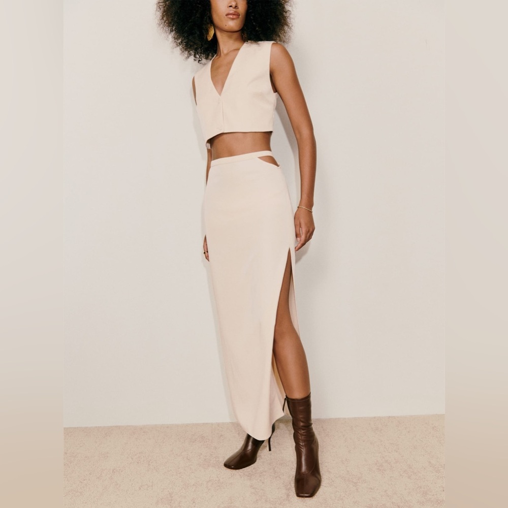 two piece set with a sleeveless, cropped top and a midi skirt with a side slit.